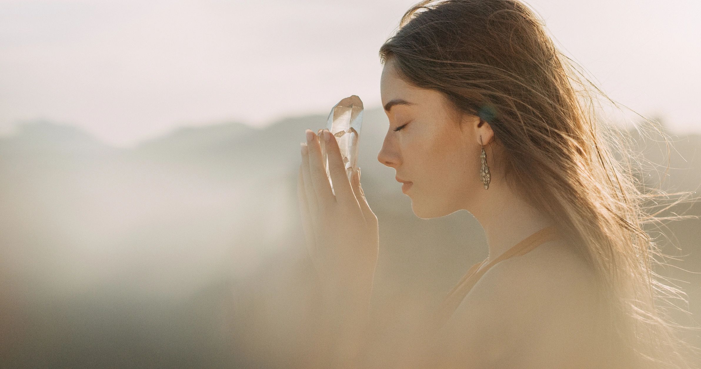 Woman in contemplation with soft golden light